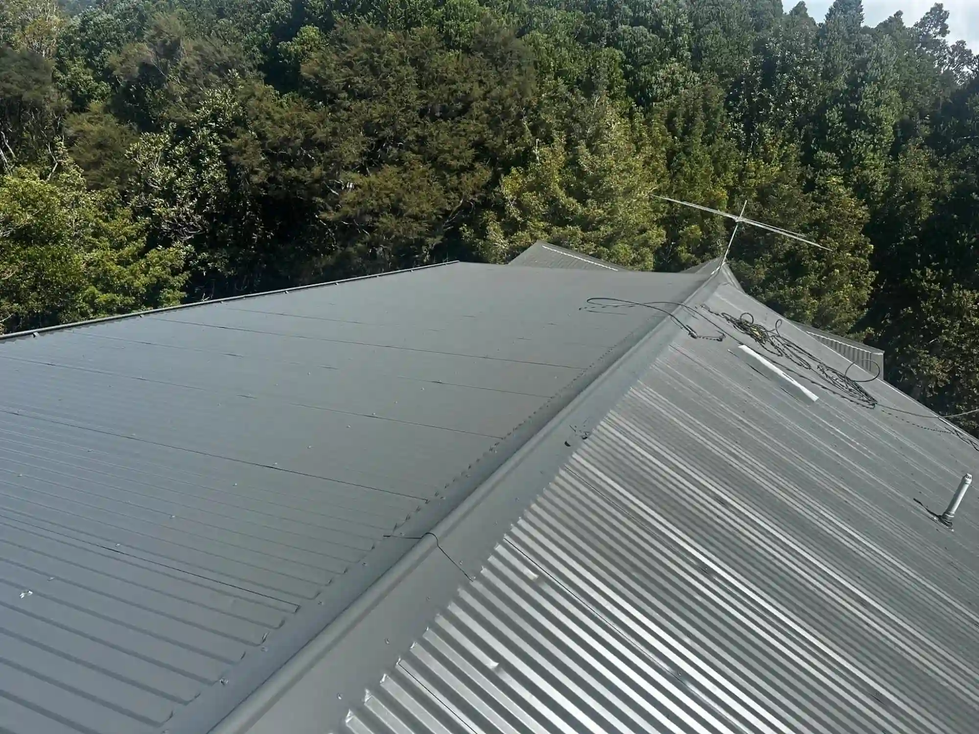 Roof repair contractor inspecting roof damage