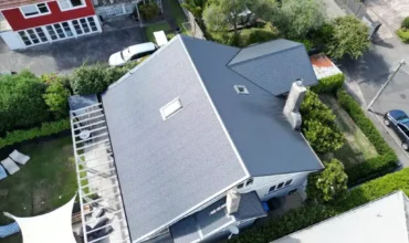 Roof repair specialist fixing damaged roof tiles