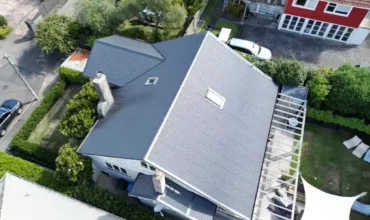 Roof repair specialist fixing damaged roof tiles