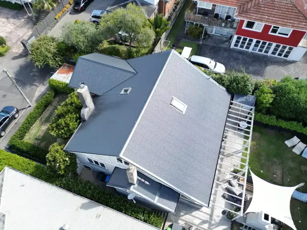 Roof repair specialist fixing damaged roof tiles